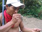 Shacay Checks the Blowgun Dart - Ecuador, January 2006