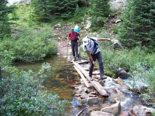 Steve Hoffmeyer and Roger Wendell negotiating a creek in the Holy Cross Wilderness - 08-07-2005